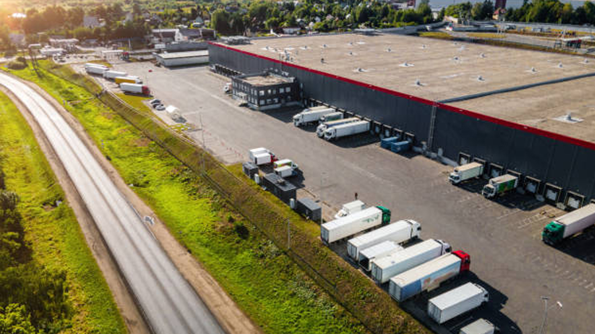 Loading bay, industrial building, logistics – aerial view